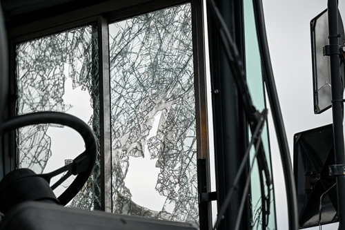 Bus crash with smashed windows after an accident illustrating cases handled by a Fort Mill bus accident lawyer. at Panchenko Law Firm.