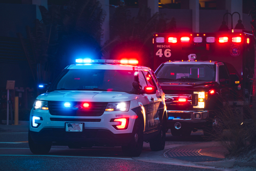 Two ambulances rushing to the scene of a speed related accident, symbolizing the severe injuries and emergency response often involved in high-speed crashes — Panchenko Law Firm Matthews car accident lawyer.
