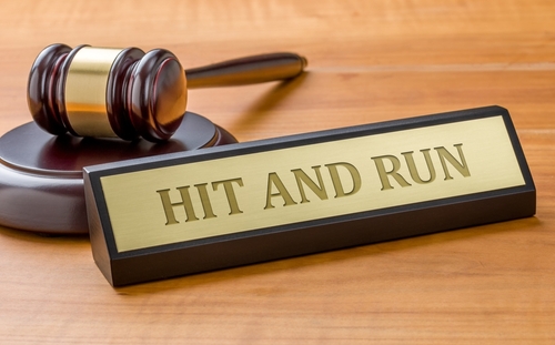 Wooden nameplate reading “Hit and Run” with a gavel in the background as if you are in court. Contact Panchenko Law Firm today to start your Monroe hit and run accident claim.