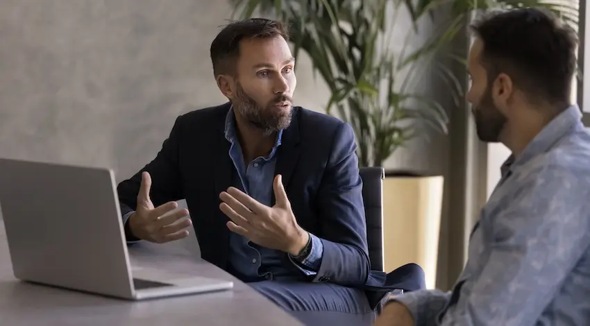 An attorney is explaining the car accident claim process to a client during a legal consultation meeting at Panchenko Law Firm in Spartanburg SC.