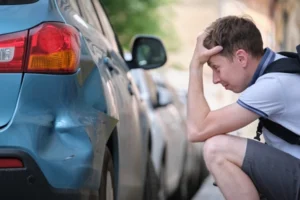 Picture of a car crash aftermath where a hit and run accident lawyer advises clients on the next steps to report a hit and run and submit their claim to the insurance company.