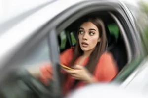 Woman Driving Distracted - Distracted Driving Accident