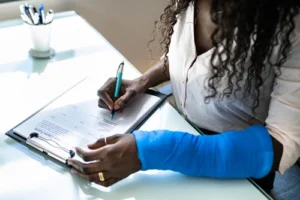 Fort Mill rideshare accident lawyer assisting injured woman filling out a claim form after a rideshare accident.