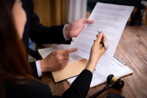 Matthews car accident lawyer reviewing an accident claim with a client after a multi-car accident, providing legal guidance and support.