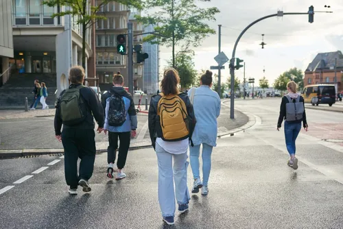 Group of pedestrians crossing the street